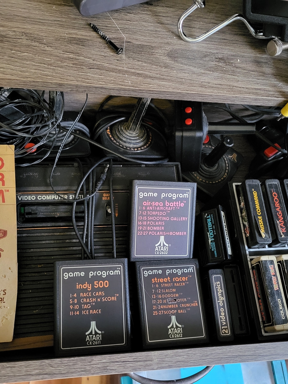 Atari Video Game Console with 4 Black Joysticks Controllers and Game Cartridges